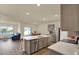 Open-concept kitchen featuring a large island, stainless steel appliances, and seamless flow to living areas at 31879 Treasure Dock Isle, Wesley Chapel, FL 33545