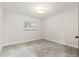 Bright bedroom featuring natural light from the window and a concrete floor at 360 22Nd Ne Ave, St Petersburg, FL 33704