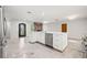 Bright, open kitchen with a large island, stainless steel appliances, and white cabinets at 360 22Nd Ne Ave, St Petersburg, FL 33704