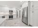 Bright modern kitchen with stainless steel appliances, white cabinets, and open design at 360 22Nd Ne Ave, St Petersburg, FL 33704