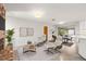 Bright living room featuring modern furniture, a red brick fireplace, and access to a screened patio at 360 22Nd Ne Ave, St Petersburg, FL 33704