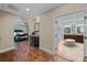 Hallway showcasing a view of the primary suite, bathroom, and coffee bar at 3601 W Lykes Ave, Tampa, FL 33609