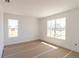 Bright, unfinished bedroom featuring large windows, awaiting your personal touch and design at 4280 Cape Haze Dr, Placida, FL 33946