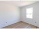 A bedroom during construction, featuring fresh paint, trim and a large window for natural light at 4280 Cape Haze Dr, Placida, FL 33946