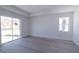 A spacious main bedroom shows a sliding glass door leading to the back and a large window at 4280 Cape Haze Dr, Placida, FL 33946
