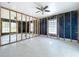 Sun-filled living room with polished concrete floors and ample natural light at 560 Baywood N Dr, Dunedin, FL 34698