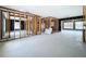 Spacious living room being remodeled with framing and concrete flooring at 560 Baywood N Dr, Dunedin, FL 34698