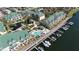 Aerial view of waterfront condominiums with boat docks, swimming pool, and lush landscaping at 6327 Sunset Bay Cir, Apollo Beach, FL 33572