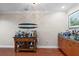 Bar area with wood floors, decorative decor, and storage at 6327 Sunset Bay Cir, Apollo Beach, FL 33572