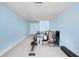 Spacious unfinished basement featuring blue walls and carpeting, great for storage or ready to be customized at 6327 Sunset Bay Cir, Apollo Beach, FL 33572