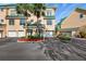Charming condo with a green roof, complemented by lush landscaping and a private garage at 6327 Sunset Bay Cir, Apollo Beach, FL 33572
