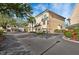 Beautiful condo with a green roof, complemented by lush landscaping and a private garage at 6327 Sunset Bay Cir, Apollo Beach, FL 33572