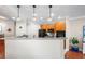 Well-equipped kitchen with modern appliances, ample counter space, and stylish pendant lighting at 6327 Sunset Bay Cir, Apollo Beach, FL 33572