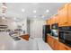 Well-equipped kitchen with modern appliances, ample counter space, and an open layout to living area at 6327 Sunset Bay Cir, Apollo Beach, FL 33572