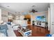 Bright living room featuring hardwood floors, stylish furniture, and an open layout to the kitchen at 6327 Sunset Bay Cir, Apollo Beach, FL 33572