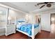 Comfortable main bedroom with white furniture, a ceiling fan, and an adjoining closet at 6327 Sunset Bay Cir, Apollo Beach, FL 33572