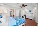 Main bedroom featuring hardwood floors, a walk-in closet, and an en suite bathroom at 6327 Sunset Bay Cir, Apollo Beach, FL 33572