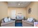 Cozy patio with comfortable wicker furniture, ceiling fan, and decorative wall art at 6327 Sunset Bay Cir, Apollo Beach, FL 33572