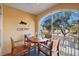 Cozy screened-in patio with comfortable seating and relaxing view of the water at 6327 Sunset Bay Cir, Apollo Beach, FL 33572