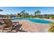 Inviting outdoor pool area with lounge chairs and well-maintained brick paver deck at 6327 Sunset Bay Cir, Apollo Beach, FL 33572