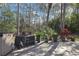 Outdoor patio area surrounded by lush foliage and privacy at 6395 Pinestand Ct, Spring Hill, FL 34606