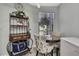 Bright breakfast nook with a glass top table and floral chairs, perfect for morning coffee at 6395 Pinestand Ct, Spring Hill, FL 34606