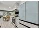 Open concept kitchen flows into the dining and living spaces, perfect for entertaining at 6395 Pinestand Ct, Spring Hill, FL 34606