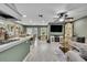 Open-concept living space features a dining area, comfortable seating, and a view to the kitchen at 6395 Pinestand Ct, Spring Hill, FL 34606