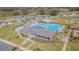 Aerial view of community clubhouse and pool, showcasing resort-style amenities at 6494 Beverly Hills Dr, Zephyrhills, FL 33541