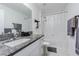 Bathroom with granite countertops, and a tub shower with a shower curtain at 6494 Beverly Hills Dr, Zephyrhills, FL 33541