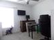 Cozy home office/bedroom featuring carpet, desk, and a decorative elephant at 6494 Beverly Hills Dr, Zephyrhills, FL 33541