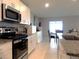 Well-equipped kitchen featuring modern appliances, sleek countertops, and ample cabinet space at 6494 Beverly Hills Dr, Zephyrhills, FL 33541