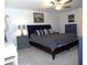 Bright main bedroom features a ceiling fan, stylish decor, and comfortable furnishings at 6494 Beverly Hills Dr, Zephyrhills, FL 33541
