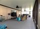 Covered patio featuring stylish furniture and ceiling fans, perfect for outdoor relaxation and entertaining at 6494 Beverly Hills Dr, Zephyrhills, FL 33541