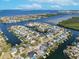 Beautiful aerial view showcasing the waterfront home and its access to the bay at 6606 Dolphin Cove Dr, Apollo Beach, FL 33572