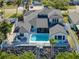 Aerial view of house with pool and canal in the back at 6606 Dolphin Cove Dr, Apollo Beach, FL 33572