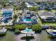 Aerial view of home featuring private pool and dock with gulf access at 6606 Dolphin Cove Dr, Apollo Beach, FL 33572