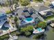 Breathtaking aerial view showcases the backyard pool, private dock, and boat lift of this waterfront property at 6606 Dolphin Cove Dr, Apollo Beach, FL 33572