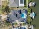 Straight down aerial view of a waterfront property with a pool, private dock, and boat lift at 6606 Dolphin Cove Dr, Apollo Beach, FL 33572