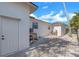 Yard view features a walkway, gravel, and building details, highlighting the well-maintained outdoor space at 6606 Dolphin Cove Dr, Apollo Beach, FL 33572