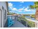 Balcony overlooking waterfront property with lounge chairs and clear blue skies at 6606 Dolphin Cove Dr, Apollo Beach, FL 33572