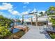 Private dock with a boat lift for easy water access at 6606 Dolphin Cove Dr, Apollo Beach, FL 33572