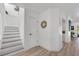 Bright foyer showcasing the staircase and access to the kitchen at 6606 Dolphin Cove Dr, Apollo Beach, FL 33572