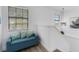 Hallway seating area with bench, and natural light near the stairs at 6606 Dolphin Cove Dr, Apollo Beach, FL 33572