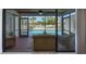 Screened lanai with wicker furniture overlooking a sparkling swimming pool and outdoor deck at 6606 Dolphin Cove Dr, Apollo Beach, FL 33572