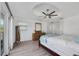 Bright main bedroom with a ceiling fan, and balcony access at 6606 Dolphin Cove Dr, Apollo Beach, FL 33572