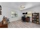 Bright home office area with a ceiling fan, natural light, and desk at 6606 Dolphin Cove Dr, Apollo Beach, FL 33572