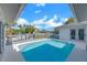 Picture-perfect pool and patio creates a luxurious backyard oasis for relaxation and recreation at 6606 Dolphin Cove Dr, Apollo Beach, FL 33572