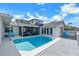 Inviting pool area, deck, screened-in porch, and views to the second story balcony create outdoor living space at 6606 Dolphin Cove Dr, Apollo Beach, FL 33572