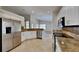 Modern kitchen featuring stainless steel appliances and granite countertops at 6805 Winslow St, Sarasota, FL 34243